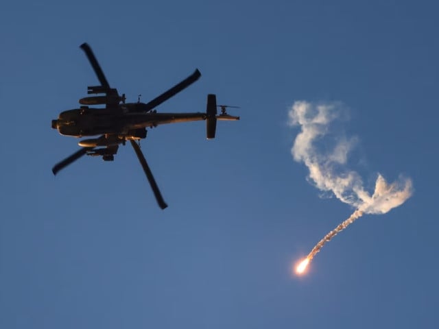 n israeli military apache helicopter releases a flare as it flies near the israel gaza border amid the conflict between israel and hamas as seen from israel july 25 2024 photo reuters